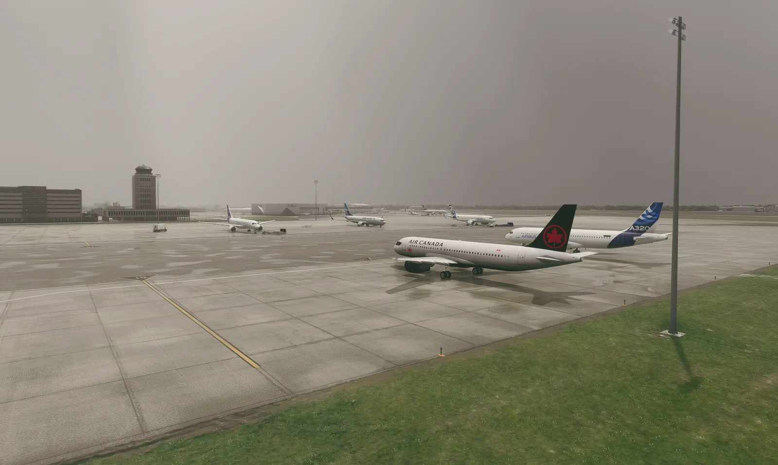 Aircraft at the gate on a wet apron in low visibility